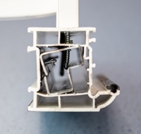 Section view of reinforced profile with miss-aligned retaining and handle attachment screws.